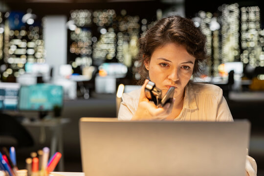 Female employee focuses on a business strategy puzzle or dilemma, imagining creative concepts and projecting future outcomes while seeking a new perspective for planning and decisions.