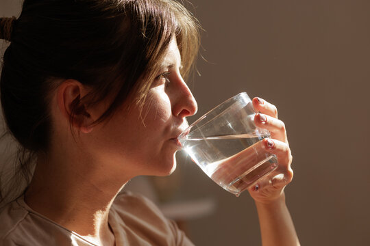Woman Profile Drinking Water for Daily Hydration and Health