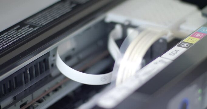 Close up detail of inside working printer while printing