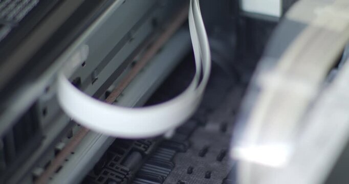 Close up detail of inside working printer while printing