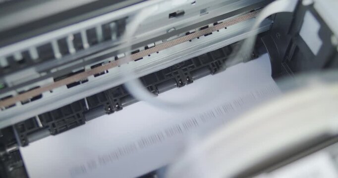 Close up detail of inside working printer while printing