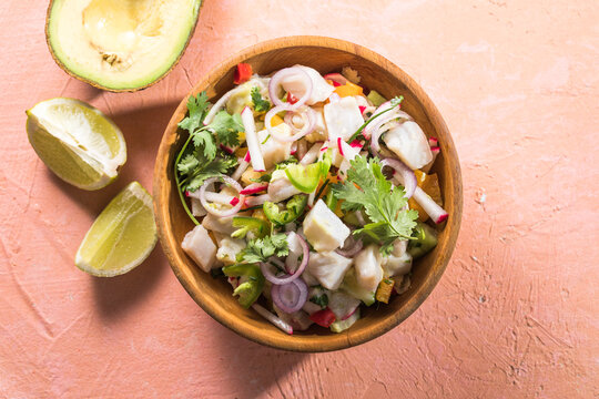 A freshly made white fish ceviche with tomato red onion cilantro red pepper lime and serrano peppe
