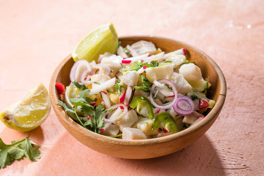 A freshly made white fish ceviche with tomato red onion cilantro red pepper lime and serrano peppe