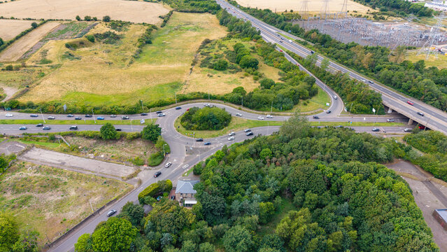 Aerial view of busy traffic at Straiton Junction on A720 Edinburgh City Bypass highway in Scotland