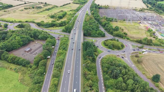 Aerial view of cars driving on highway overpass near Straiton Junction in Edinburgh, Scotland