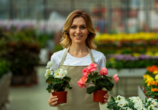 Greenhouse Florist Holding Flowers.
