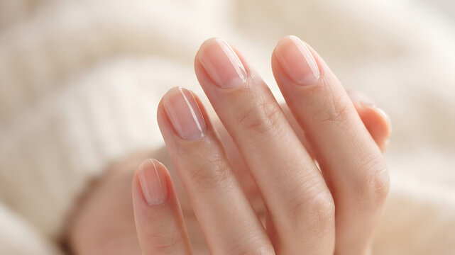 Close up of natural manicured nails and healthy hands