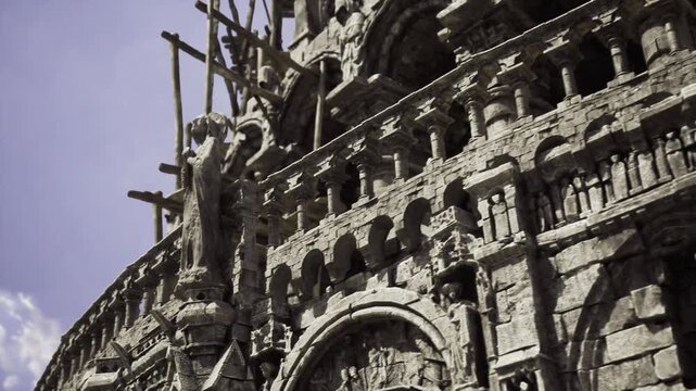 Elaborately carved exterior featuring dramatic shading patterns. Ornately detailed facade highlighted by strong shadows and artistic sketches