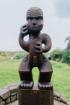 AUCKLAND, NEW ZEALAND &ndash; 14 August 2026: A carved Maori Pouwhenua stands as a guardian at the entrance to the coastal landscape of Karekare Beach.