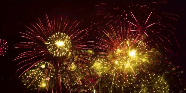 Colorful fireworks exploding in the night sky. Celebrations and events in bright colors. A new year's fireworks over the city of Guangzhou, China. Fireworks background. abstract golden shining glowing