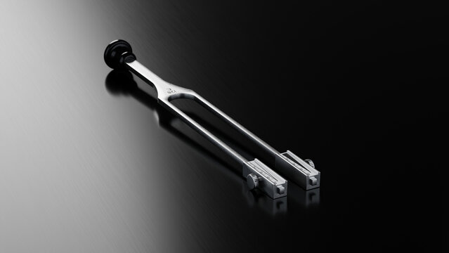 Premium Medical Tuning Fork C128 Hz on Brushed Dark Metallic Surface