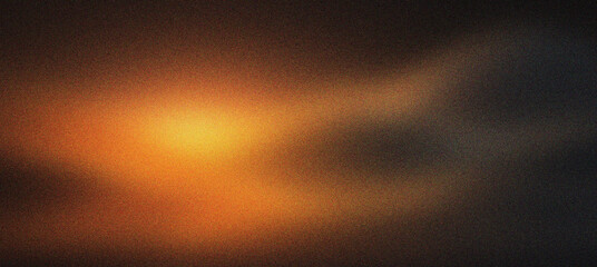 Fototapeta premium Cinematic lens flare with warm orange light leak on dark background. Abstract glowing light effect for film overlay. Moody amber light texture for creative video editing and photo overlays.