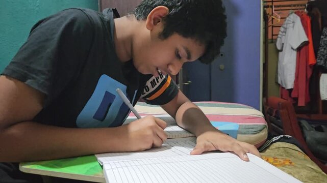 Young Student Studying at Home, Boy Writing Homework in Notebook at Desk, School Education and Learning Concept, Child Doing Schoolwork, Academic Preparation, Home Study and Student Lifestyle