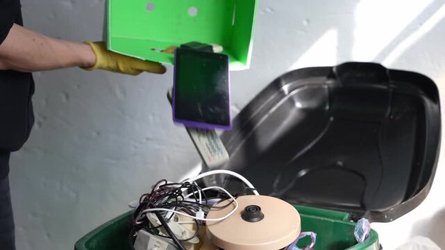 Male dumping obsolete electronic devices pollution concept