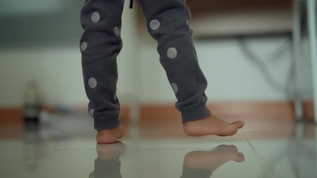 Child Moving Legs and Feet to the Rhythm of Music