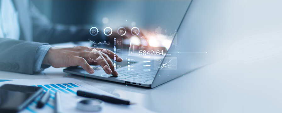 An analyst uses a laptop data business analysis on dashboard for profit, income and financial data growth and long-term investment with data management system and metrics connected to the database.
