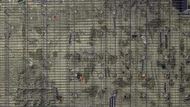 Aerial view of the structural preparation stage of an industrial warehouse featuring a grid of steel reinforcing bars and welded wire mesh in Mt. Juliet, Tennessee, United States.