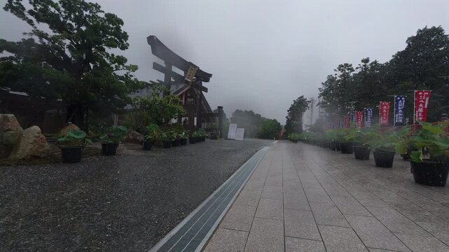 Cinematic Wet Shrine Pathway with Stone Torii Gate Fukuoka 4K