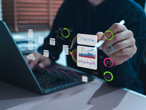 Business professional analyzing AI-powered data analytics with interactive dashboard, data visualization, business intelligence, machine learning, big data, automation, and digital transformation.
