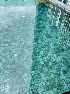 Turquoise Swimming Pool Water Surface with Mosaic Tile Texture