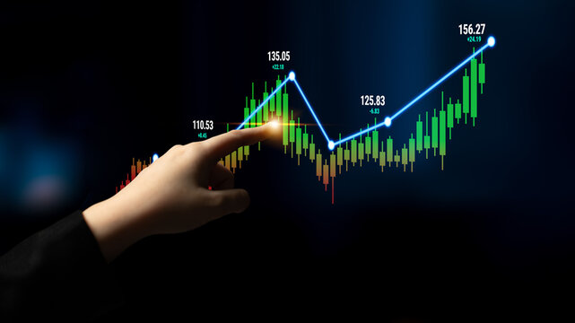 Business growth concept with hand pointing at ascending stock market chart showing progress and success in financial investments and analysis Quark.