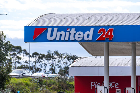 United 24 branding signage of a petrol station in Melbourne, Victoria, Australia. It indicates a United Petroleum service station that operates 24 hours a day