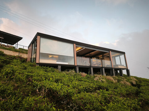 Glass Restaurant Building on Hillside at Dusk in Highlands