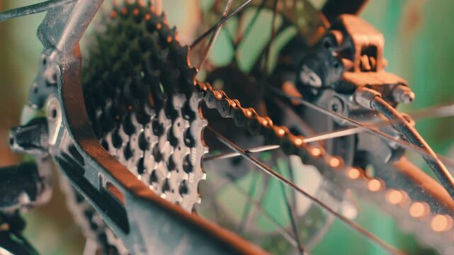 Bicycle Cassette and Gear Sprockets in Slow Motion | Rear Wheel Drivetrain Mechanism with Chain | Bike Maintenance Macro Detail. Close-Up Rotating Shot
