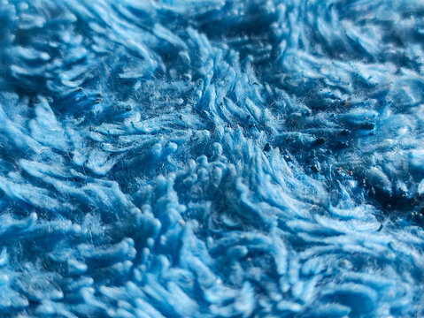 Closeup of blue microfiber fabric texture background.