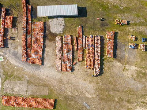 Aerial view of rows of orange storage containers arranged in an industrial yard in Kleinvlei, Cape Town, Western Cape, South Africa.