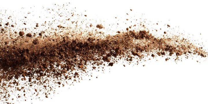 Fine brown powder explodes upward in a dynamic cloud formation against a white background
