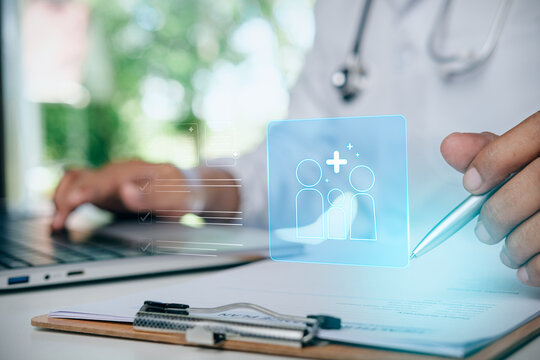 Doctor or health insurance agent reviewing family medical insurance policy document with digital family health care holographic icon, healthcare coverage concept and family financial protection.