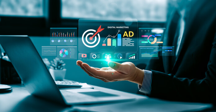 Digital marketing analytics concept with business professional holding virtual advertising dashboard showing target campaign data, online ad performance, audience and sales growth strategy