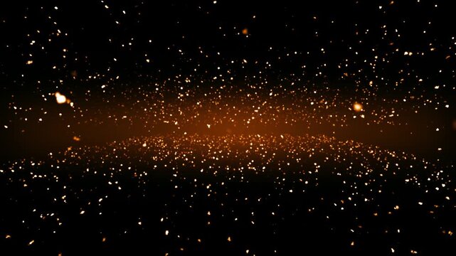 Glowing golden particles floating in a dark cosmic space background with shimmering light effects and dynamic motion