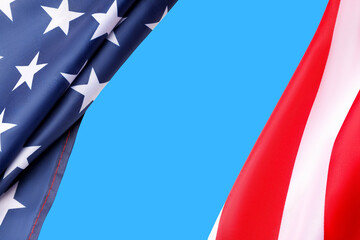 Fototapeta premium American flag waves proudly in bright blue sky for Labor Day