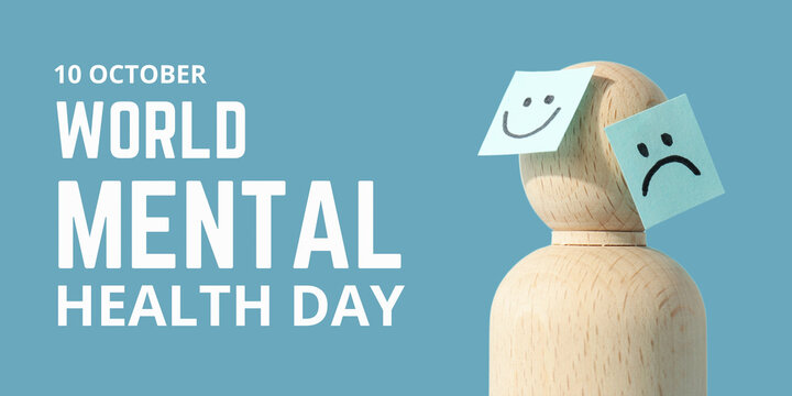 World Mental Health day. Wooden figure displays positive and negative emotions on sticky notes