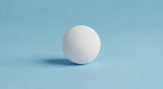 A single white matte ping pong ball isolated on a light blue background with subtle shadow