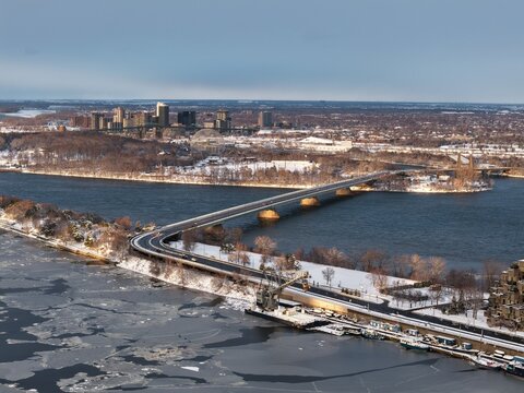 Aerial view of Concorde Bridge over the Saint Lawrence River in Montreal, Quebec, Canada, in winter. g.