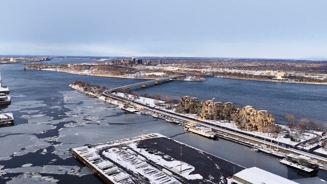 Aerial view of Concorde Bridge over the Saint Lawrence River in Montreal, Quebec, Canada, in winter. g.