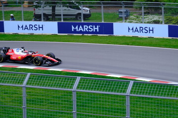 Fototapeta premium May 24, 2025, Montreal, Canada, Charles Leclerc drives Ferrari F1 car at Circuit Gilles Villeneuve. g.