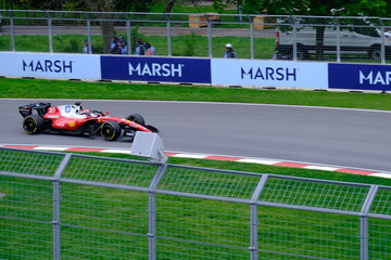 Fototapeta premium May 24, 2025, Montreal, Canada, Charles Leclerc drives Ferrari F1 car at Circuit Gilles Villeneuve. g.