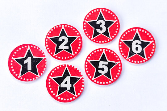 round red coins numbered one, two, three, four, five and six (1,2,3,4,5,6) can be used scoring