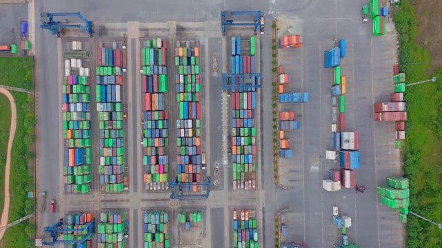 Aerial view of TPK Palaran container terminal with rows of colorful shipping containers at the port in Samarinda, East Kalimantan, Indonesia.