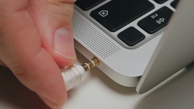 Close Up USB Wire Plugged Into Laptop for Charging Electronic Devices