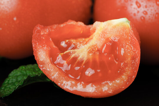 Fresh Tomato Slice with Water Droplets - Ripe Red Vegetable Close-Up