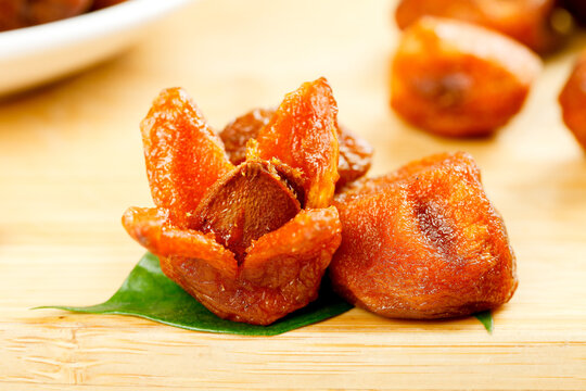 Xinjiang Dried Apricots Traditional Chinese Dehydrated Fruit Snacks on Wooden Board