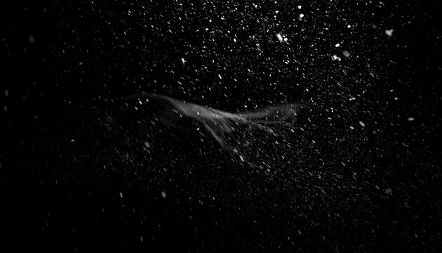 Dynamic motion of white particles and dust swirling against a dark black background creating a sense of movement and energy