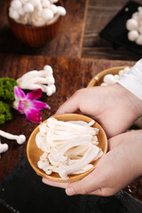 Fresh White Edible Mushrooms from Yunnan Province in Wooden Bowl - High Quality Asian Fungi Ingredients © NgoVan