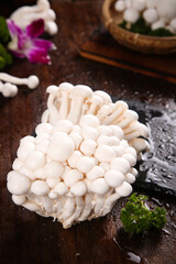 Fresh White Edible Mushrooms from Yunnan Province China on Wooden Table with Traditional Basket © NgoVan