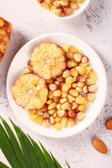 Fresh Yellow Corn Kernels and Cob Slices in White Bowl - Healthy Natural Food Ingredients © DoThi